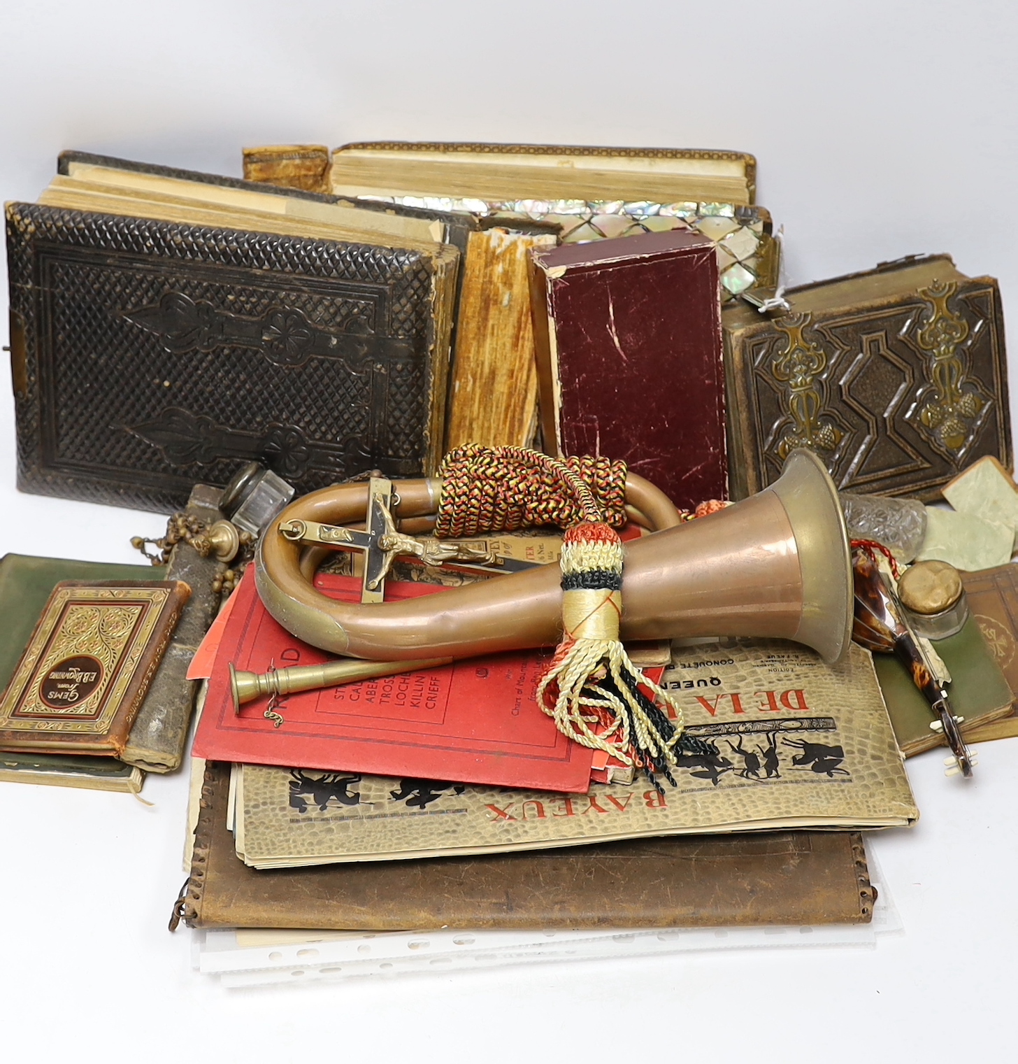 Sundry items including ephemera, empty Victorian photograph albums, bugle, miniature books, rosary and silver lidded glass pot